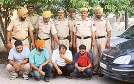 Special staff of the Panchkula police with the four car thieves on Thursday