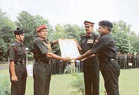 The GOC-in-C Western Command, Lieut-Gen S. Pattabhiraman, presents the GOC-in-C’s unit citation to the Commanding Officer of 118 Engineers, Col Manoj Kumar, and Sub Maj J.K. Tiwari at Chandimandir on Thursday