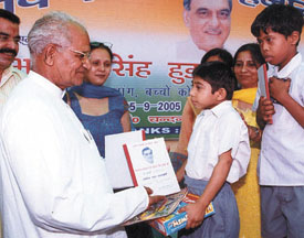 MCF Deputy Mayor Shiv Charanlal Sharma distributing stationery items to physically-challenged students at Bal Bhawan in Faridabad on Thursday