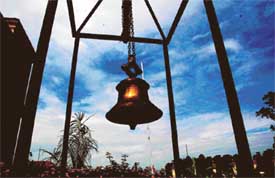  A school bell on a cloudy morning gives the impression of alighted lamp
