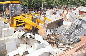 A marble market being demolished during a drive at Raipur Khurd in Chandigarh on Friday. 