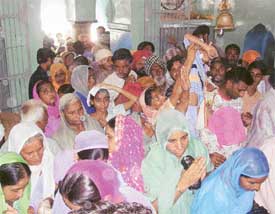 Devotees throng the Guga Mari temple at Chhapar village in Ludhiana on Friday