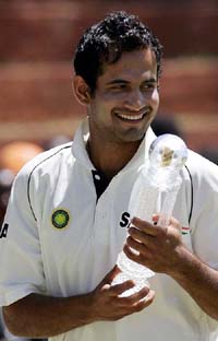 Irfan Pathan holds the man of the match trophy after the conclusion of the first Test between India and Zimbabwe in Bulawayo