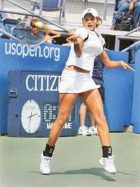 Unimpressed by her performances, Muslim clerics want Sania Mirza (top) to cover herself up like the Iranian players who took part in the Asian Badminton Championship in Hyderabad recently. 