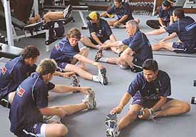 Members of the Australian under-19 cricket team warm up at the PCA stadium in Mohali on Saturday
