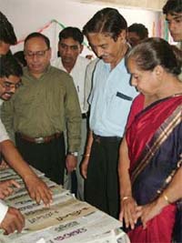 Former Dainik Tribune Editor Vijay Sehgal and Guru Jambheshwar University Vice-Chancellor R.P.Bajpai at an exhibition of newspapers on the GJU premises in Hisar