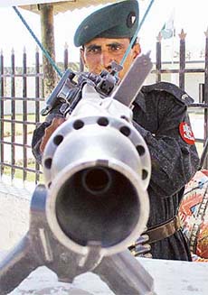 A Pakistan soldier mans a machine-gun as security was tightened at the Pakistan-Afghanistan border town of Chaman, 125 km from Baluchistan's provincial city of Quetta