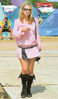 British supermodel Kate Moss walks through the Glastonbury Festival, Somerset, in this June 28, 2003, file photo.