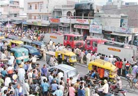 Fire engines parked on the road after dousing the fire