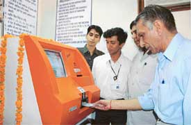The PSEB Chairman, Mr Y. S. Ratra, inaugurates an electronic bill payment machine in Janta Nagar division, Ludhiana, on Monday.