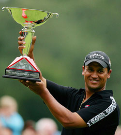 New Zealands Michael Campbell lifts the trophy after beating Irelands Paul McGinley in the final of the World Match Play Championship at Wentworth in southern England 