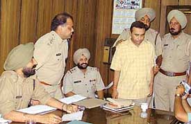 Accused Micky Jain in police custody.