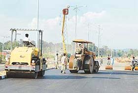 The carpeting of the road leading to Chandigarh Technology Park in full swing to meet the deadline of the Prime Ministers visit to the city
