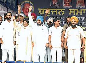 BSP President Mayawati waves to a crowd at a rally in Ludhiana