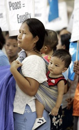 Activists from the Women's League of Burma (Myanmar) participate in a peace march, as they call for peace in Myanmar and the world, to mark the International Day of Peace in New Delhi on Wednesday