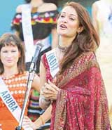 Miss India Vaishali Desai, a candidate for the Miss International pageant, greets the crowd during a gathering of international beauties in Nagakute, Aichi Prefecture on Wednesday. Fiftythree contestants taking part in the final leg of the beauty pageant which will be held on September 26 in Tokyo.