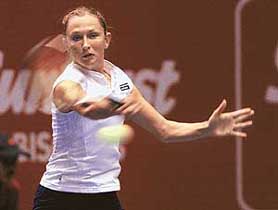 Russias Elena Likhovtsva plays a return shot during her match against Ukraines Yuliana Fedak at the WTA Sunfeast Open in Kolkata on Wednesday. Likhovtsva won 6-1, 6-3.