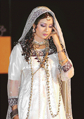 A Pakistani model presents a fashion inspired by the folk character of Anarkali at a fashion show on Wednesday in Islamabad.