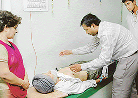 An inmate of Sri Sathya Sai Old Age Home being examined at a medical camp on Thursday.