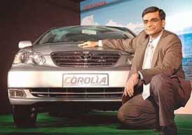 K.K. Swamy, Deputy Managing Director, Toyota Kirloskar Motor Pvt Ltd poses with a newly launched Toyota Corolla in New Delhi