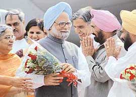 Prime Minister Manmohan Singh and his wife Gursharan Kaur being received by PPCC chief Shamsher Singh Dullo at the Chandigarh airport on Friday. Also seen in the picture are Chandigarh MP Pawan Bansal and Mayor Anu Chathrath.
