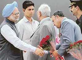 The Punjab Governor, Gen S.F. Rodrigues (retd), greets the Prime Minister Dr Manmohan Singh.