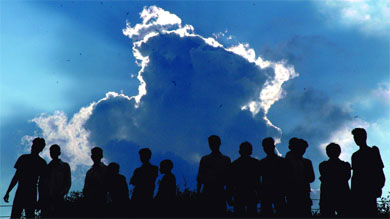 People enjoying the overcast conditions at India Gate on Friday
