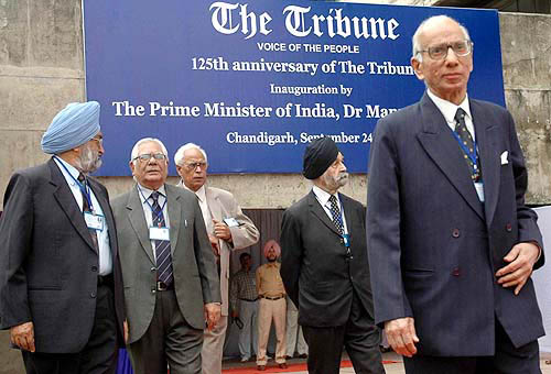 Trustees of The Tribune Trust wait for the arrival of the Prime Minister