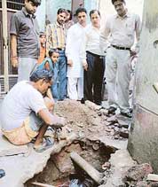 An MC team checks water pipes after some deaths due to diarrhoea in gali No. 12, Jawahar Nagar, Ludhiana, on Saturday. 