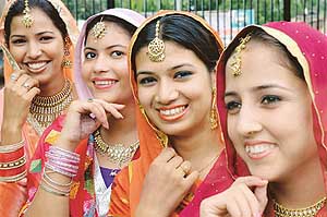 The members of a giddha team wait for their turn during a talent-hunt competition at Multani Mal Modi College in Patiala on Saturday.