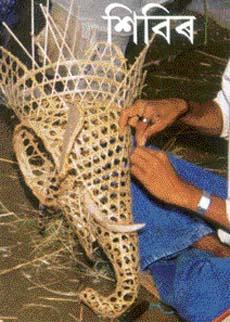 An artiste makes the skeleton of a mask