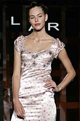 A model displays a creation by Spanish designer Pilar Ruiz during the womens spring/summer, 2006, fashion week show in Milan on Saturday.
