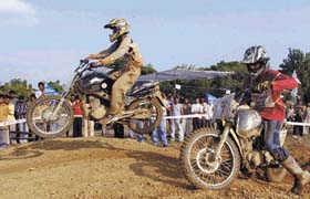 Two motorcyclists at the Delhi Motocross Challenge 2005, organised by the Delhi Automotive Racing Academy (DARA) in the Capital