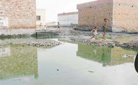 Sewage which has accumulated on a plot in the absence of a proper disposal system in the colony