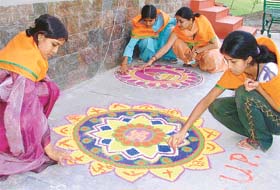 Students representing various states take part in a rangoli competition during the national integration camp organised at MTS College