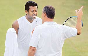Indian Davis Cup team captain and doubles player Leander Paes argues with a Swedish official after the doubles match was stopped due to bad light during the Davis Cup tie in New Delhi on Sunday