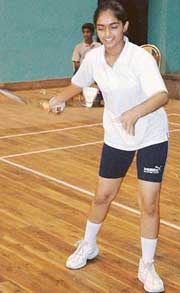 Ramandeep Kaur of St Xaviers School, Sector 44, serves during an under-13 singles tie in the Chandigarh State Badminton Meet that began at the Sector 42 indoor hall, Chandigarh, on Monday. 