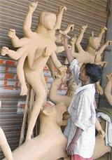 An artist busy making idols of Goddess Durga for Durga Puja that starts on October 4