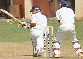 A batsman of Bishnoi Cricket Club plays a shot during the quarterfinal against Mumbai Cricket Association in the JP Atray Cricket Tournament at DAV College, Sector 10
