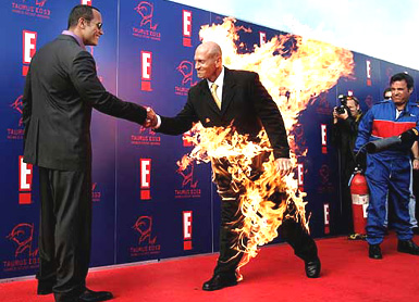 Dwayne The Rock Johnson shakes hands with professional stuntman Jim Trella at the fifth Annual Taurus World Stunt Awards function at Paramount in Los Angeles on Sunday