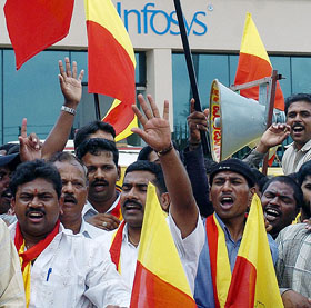 Protesters shout slogans in front of the Infosys office in Bangalore on Tuesday