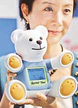 Japanese toy giant Tomy unveils robotic bear Chatty Tom, developed to teach English, in Tokyo on Tuesday