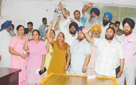 Opposition councillors stage a dharna at the Municipal Corporation house after the Mayor and the Commissioner had left the place in Ludhiana