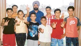 The medal-winning swimmers of BVM School with Mr Baljit Singh Gill, Director, Sports, BVM educational institutions