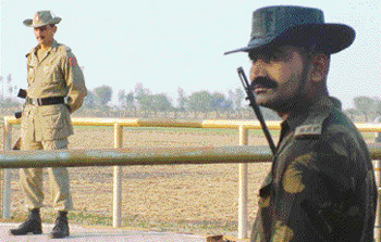 A BSF jawan and Pakistan Ranger at a hairs breath from each other at zero line on Indo-Pak border near Amritsar