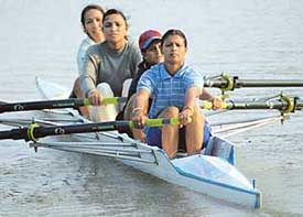 Rowing players of the CRPF Babita, Monalisa, Ranjana and Rameshwari on way to win gold medal in four women category of the Chandigarh Water Sports Tournament at Sukhna Lake on Wednesday. 