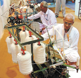 Weavers at the ongoing exhibition on National Exposition of Small, Agro and Rural Industries at Ashoka Hotel in the Capital