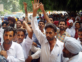 Farmers protest against irregularities in the sale of wheat seeds at Kisan Mela in Bathinda on Wednesday.