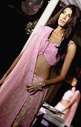 A model displays an outfit by Pakistani fashion designer Shayan Malik during a fashion show in Karachi on Thursday