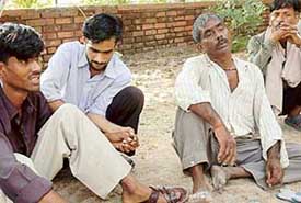 Pinkys husband Hari Ram and other relatives grieve after she ended her life along with that of her two children in Chandigarh on Thursday